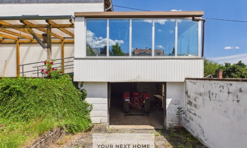 „Ihr neues Zuhause in Ommersheim: Großzügiges Einfamilienhaus mit Wintergarten & Garage“