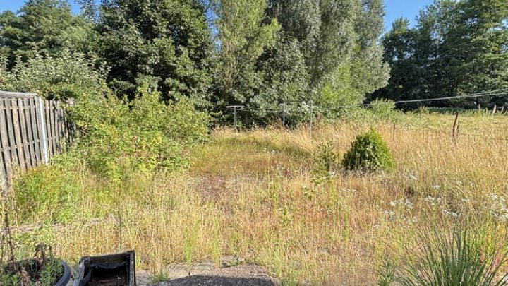 Großzügiges Einfamilienhaus mit Garage und kleinem Garten