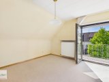 Schlafzimmer mit Zugang zum Balkon