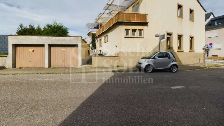 Wohn- und Geschäftshaus in St. Ingbert - für Investoren - mit Wohnung, Gewerbe, Garten und Garagen