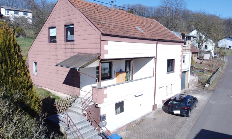 Einfamilienhaus mit Garten, Garage und Stellplatz – Viel Potenzial für Ihre Ideen
