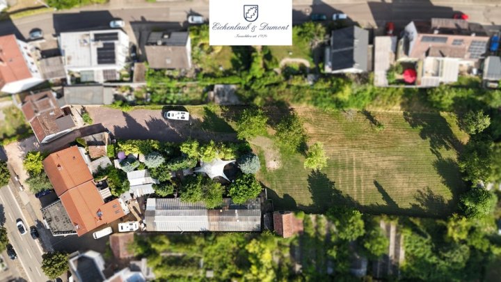 Wohn- und Geschäftshaus plus Nebengebäude und Grundstück